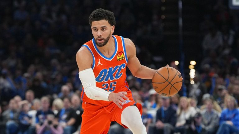 Oklahoma City Thunder guard Ajay Mitchell pushes down the court during the second half of an NBA basketball game against the Miami Heat, Sunday, Jan. 11, 2026, in Oklahoma City. (AP Photo/Kyle Phillips)