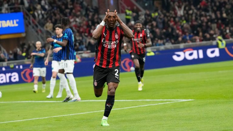 AC Milan's Pervis Estupinan celebrates after scoring the opening goal during the Serie A soccer match between AC Milan and Inter Milan, in Milan, Italy, Sunday, March 8, 2026. (AP Photo/Luca Bruno)