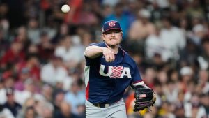 USA pitcher Logan Webb throws to first for an out on Brazil's Gabriel Do Carmo during the third inning of a World Baseball Classic game, Friday, March 6, 2026, in Houston. (AP Photo/Ashley Landis)