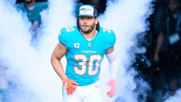 Miami Dolphins fullback Alec Ingold (30) runs onto the field during player introductions before an NFL football game against the Tampa Bay Buccaneers, Sunday, Dec. 28, 2025, in Miami Gardens, Fla. (AP Photo/Doug Murray)