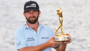 Cameron Young holds The Players Championship Trophy after winning the tournament, Sunday, March 15, 2026, in Ponte Vedra Beach, Fla. (AP Photo/Gerald Herbert)