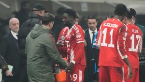 Bayern's Alphonso Davies leaves the field injured during the Champions League round of 16 soccer match between Atalanta and FC Bayern Munich in Bergamo, Italy, Tuesday, March 10, 2026. (AP Photo/Luca Bruno)