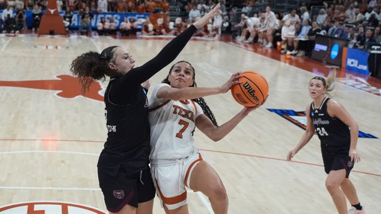 Texas guard Jordan Lee (7) drives to the basket against Missouri State forward Maiesha Washington, left, during the first half in the first round of the NCAA college basketball tournament game, Friday, March 20, 2026. (AP Photo/Eric Gay)