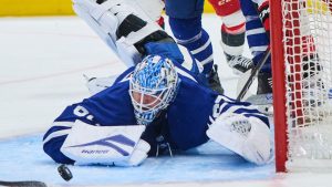 Toronto Maple Leafs goaltender Joseph Woll (60) dives to stop the puck during third period NHL hockey action against the Carolina Hurricanes in Toronto, on Friday, March 20, 2026. THE CANADIAN PRESS/Sammy Kogan