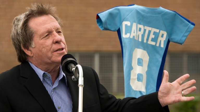 Former Expos broadcaster Rodger Brulotte speaks to reporters after the city of Montreal changed the name of Faillon street in front of the former home of the Expos, Jarry Park, to Gary Carter street in honour of the former Expo Hall of Famer Gary Carter, Tuesday, May 21, 2013 in Montreal.THE CANADIAN PRESS/Ryan Remiorz