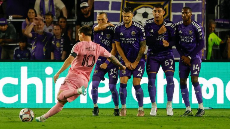 Inter Miami CF forward Lionel Messi (10) takes a penalty kick around Orlando City SC blockers during the second half of an MLS soccer match, Sunday, March 1, 2026, in Orlando, Fla. (AP Photo/Kevin Kolczynski)