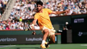 Carlos Alcaraz, of Spain, returns a shot against Daniil Medvedev, of Russia, during a semifinal match at the BNP Paribas Open tennis tournament, Saturday, March 14, 2026, in Indian Wells, Calif. (AP Photo/Mark J. Terrill)