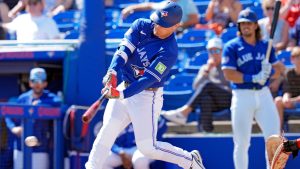 Toronto Blue Jays' Daulton Varsho hits a run-scoring fielder's choice against Canada pitcher Noah Skirrow during the second inning of an exhibition baseball game Tuesday, March 3, 2026, in Dunedin, Fla. (Chris O'Meara/AP)