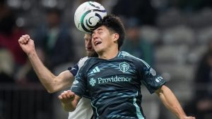 Seattle Sounders' Kalani Kossa-Rienzi, front right, and Vancouver Whitecaps' Thomas Muller vie for the ball during the second half of a CONCACAF Champions Cup soccer match, in Vancouver, on Thursday, March 12, 2026. (Darryl Dyck/CP)