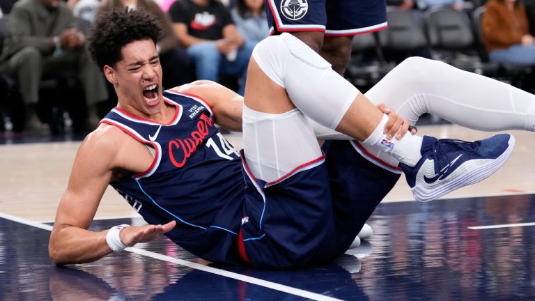 Los Angeles Clippers center Yanic Konan Niederhauser writhes on the floor after he was injured during the first half of an NBA basketball game against the Indiana Pacers, Wednesday, March 4, 2026, in Inglewood, Calif. (AP Photo/Mark J. Terrill)