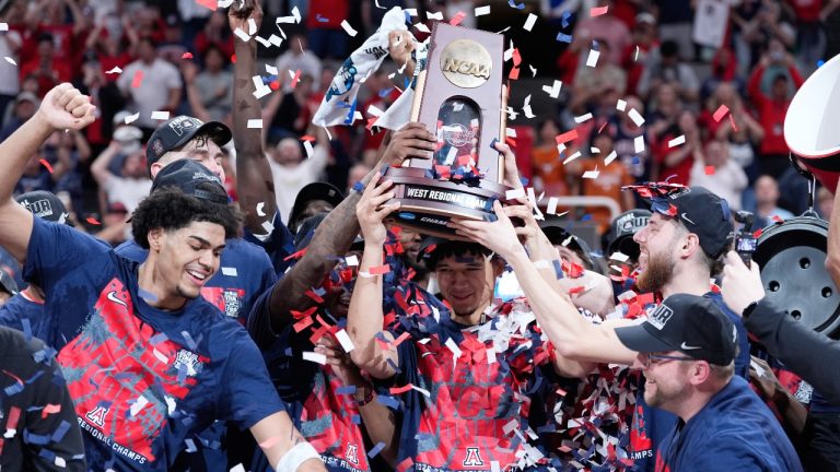 Arizona players hold a trophy after a win over Purdue in the Elite Eight of the NCAA college basketball tournament, Saturday, March 28, 2026, in San Jose, Calif. (Godofredo A. Vásquez/AP)