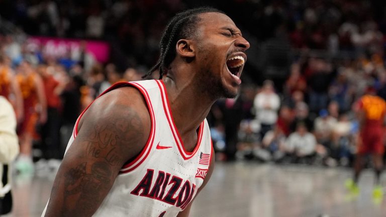 Arizona's Jaden Bradley celebrates after making the game-winning shot at the buzzer to defeat Iowa State during an NCAA college basketball game in the semifinal round of the Big 12 Conference tournament Friday, March 13, 2026, in Kansas City, Mo. (Charlie Riedel/AP Photo)