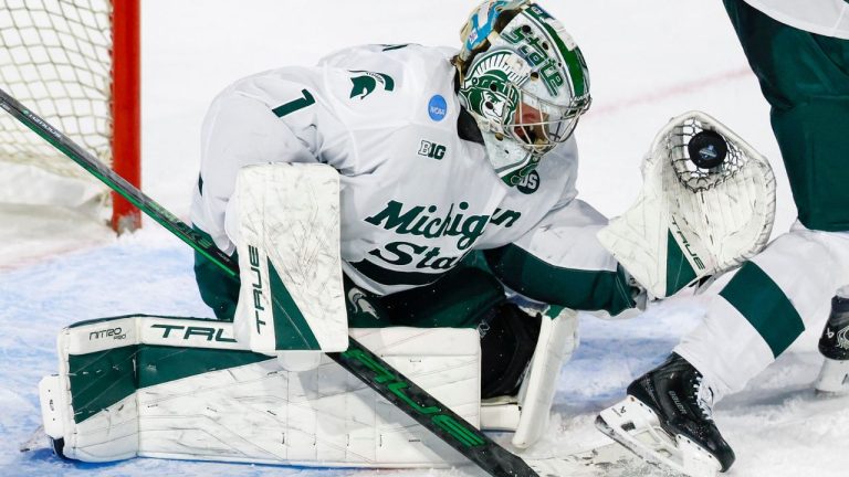 Michigan State goalie Trey Augustine (1) makes a save during the first period of an NCAA hockey regional game against UConn on Thursday, March 26, 2026, in Worcester, Mass. (Greg M. Cooper/AP Photo)