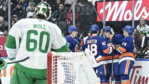 Maple Leafs goaltender Joseph Woll (60) looks on as New York Islanders players celebrate their second goal in Toronto on Tuesday March 17, 2026. (Chris Young/CP)