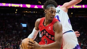Toronto Raptors' RJ Barrett (9) drives past Utah Jazz's Walter Clayton Jr. (13) during second half NBA basketball action in Toronto, on Sunday, Feb. 1, 2026. (Sammy Kogan/THE CANADIAN PRESS)