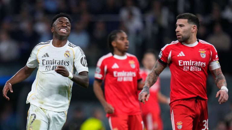 Real Madrid's Vinicius Junior, left, reacts after missing a chance to score during the second leg of the Champions League playoff soccer match between Real Madrid and Benfica in Madrid, Spain, Wednesday, Feb. 25, 2026. (Manu Fernandez/AP)