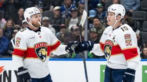 Florida Panthers' Matthew Tkachuk (19) celebrates his goal against the Vancouver Canucks with Sam Bennett (9) during the first period of an NHL hockey game in Vancouver, on Tuesday, March 17, 2026. (Ethan Cairns/CP)