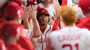 Canada catcher Bo Naylor, centre, celebrates his two-run homer against the United States during the sixth inning of a World Baseball Classic quarterfinal game, Friday, March 13, 2026, in Houston. (David J. Phillip/AP)