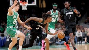 Minnesota Timberwolves guard Bones Hyland dribbles the ball past Boston Celtics forward Hugo González during the first half of an NBA game, Sunday, March 22, 2026, in Boston. (AP/Mark Stockwell)