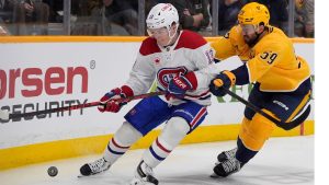 Montreal Canadiens right wing Cole Caufield (13) chases the puck past Nashville Predators defenseman Roman Josi (59) during the first period of an NHL hockey game Saturday, March 28, 2026, in Nashville, Tenn. (George Walker IV/AP Photo)
