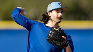 Toronto Blue Jays pitcher Dylan Cease makes a throw to first base during a drill at Spring Training in Dunedin, Fla., on Monday, Feb. 16, 2026. (Frank Gunn/CP)