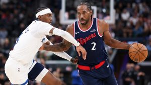 Los Angeles Clippers forward Kawhi Leonard (2) dribbles against Minnesota Timberwolves forward Jaden McDaniels, left, during the first half of an NBA basketball game, Wednesday, March 11, 2026, in Inglewood, Calif. (Jessie Alcheh/AP)