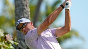 Corey Conners, of Canada, hits from the 18th tee during the third round of the Sony Open golf event at the Waialae Country Club in Honolulu, Saturday, Jan. 17, 2026. (Matt York/AP)