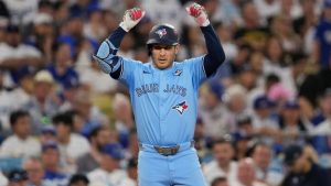 Toronto Blue Jays' Daulton Varsho celebrates his triple during the fourth inning in Game 5 of baseball's World Series against the Los Angeles Dodgers, Wednesday, Oct. 29, 2025, in Los Angeles. (Ashley Landis/AP)