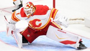 Calgary Flames goaltender Devin Cooley (1) in action during the third period of an NHL hockey game against the Washington Capitals, Monday, March 9, 2026, in Washington. (Nick Wass/AP)