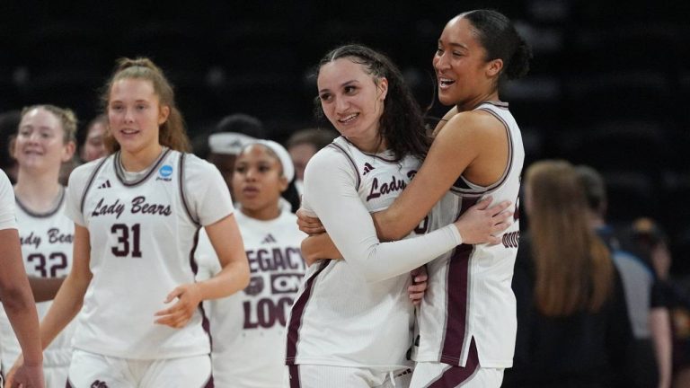 Missouri State forward Lainie Douglas, right, hugs teammate Maiesha Washington as they celebrate their win over Stephen F. Austin in a First Four college basketball game in the NCAA Tournament, Wednesday, March 18, 20206, in Austin, Texas. (Eric Gay/AP)