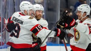 Ottawa Senators right wing Drake Batherson (19) is congratulated by right winger Claude Giroux (28) and defenseman Thomas Chabot (72) after scoring during second period NHL hockey action against the Toronto Maple Leafs in Toronto, Saturday, Feb 28, 2026. (Frank Gunn/CP)