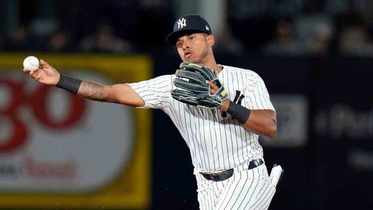 New York Yankees second baseman Jorbit Vivas forces Toronto Blue Jays' Nathan Lukes at second base and relays the throw to first in time to turn a double play against Eloy Jiménez during the sixth inning of a spring training baseball game Wednesday, March 11, 2026, in Tampa, Fla. (Chris O'Meara/AP)
