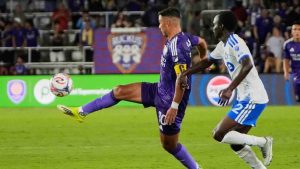 Orlando City midfielder Martin Ojeda, left, moves the ball past CF Montreal midfielder Victor Loturi during the second half of an MLS soccer match, Saturday, March 14, 2026, in Orlando, Fla. (John Raoux/AP)