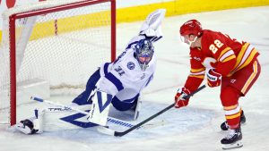 Tampa Bay Lightning goalie Jonas Johansson (31) makes a save against Calgary Flames' Ryan Strome (22) during third period NHL hockey action in Calgary, Sunday, March 22, 2026. (Larry MacDougal/CP)