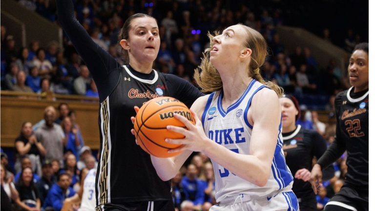 Duke's Toby Fournier, right, handles the ball as Charleston's Sophia Tougas, left, defends during the first half in the first round of the NCAA college basketball tournament, Friday, March 20, 2026, Durham, N.C. (Ben McKeown/AP Photo)