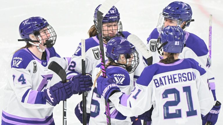 Minnesota Frost's Mae Batherson (21) celebrates with teammates Abby Hustler (74), Kendall Coyne Schofield (26), Kendall Cooper (4) and Kelly Pannek (12) after scoring against the Montreal Victoire during second period PWHL hockey action in Laval, Que., Sunday, Jan. 4, 2026. (Graham Hughes/THE CANADIAN PRESS)