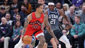 Toronto Raptors guard Markelle Fultz (20) dribbles against Utah Jazz guard Bez Mbeng (21) during the first half of an NBA basketball game, Monday, March 23, 2026, in Salt Lake City. (Rob Gray/AP Photo)