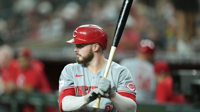Cincinnati Reds' Gavin Lux waits his turn to bat against the Arizona Diamondbacks during the first inning of a baseball game Friday, Aug. 22, 2025, in Phoenix. (Ross D. Franklin/AP)