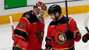 Ottawa Senators' Claude Giroux (28) and goaltender Linus Ullmark (35) celebrate the team's win against the Toronto Maple Leafs after third period NHL hockey action in Ottawa, on Saturday, Mar. 21, 2026. (Justin Tang/CP)