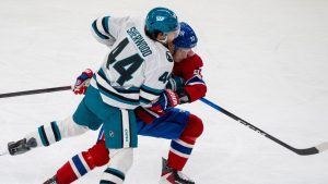 Montreal Canadiens' Ivan Demidov (93) and San Jose Sharks' Kiefer Sherwood (44) battle for the puck during first period NHL hockey action in Montreal on Saturday, March 14, 2026. (Christinne Muschi/THE CANADIAN PRESS)