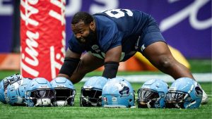 Toronto Argonauts' Ralph Holley stretches during football practice ahead of the 111th CFL Grey Cup, in Vancouver, on Thursday, November 14, 2024. (Ethan Cairns/THE CANADIAN PRESS)