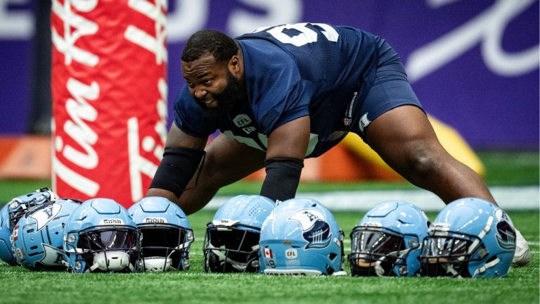 Toronto Argonauts' Ralph Holley stretches during football practice ahead of the 111th CFL Grey Cup, in Vancouver, on Thursday, November 14, 2024. (Ethan Cairns/THE CANADIAN PRESS)