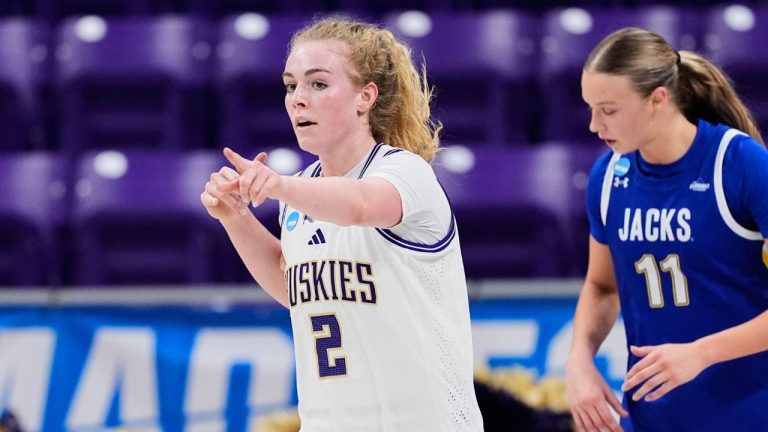 Washington guard Avery Howell (2) celebrates after sinking a basket as South Dakota State's Hadley Thul (11) follows behind in the second half in the first round of the NCAA college basketball tournament, Friday, March 20, 2026, in Fort Worth, Texas. (Tony Gutierrez/AP Photo)