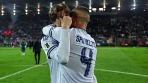Italy's Marco Palestra and Leonardo Spinazzola console each other after losing a penalty shootout during the World Cup qualifying playoff final soccer match between Bosnia and Italy in Zenica, Bosnia, Tuesday, March 31, 2026. (Armin Durgut/AP Photo)