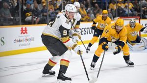 Vegas Golden Knights centre Jack Eichel (9) and Nashville Predators centre Tyson Jost (17) vie for the puck during the first period of an NHL hockey game Saturday, March 21, 2026, in Nashville, Tenn. (John Amis/AP)