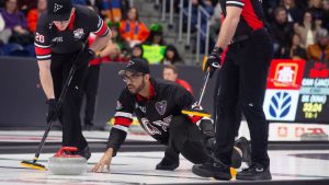 Ontario skip Jayden King throws a rock during Draw 3 at the 2026 Brier in John's NL on Saturday, Feb. 28, 2026. (Paul Daly/CP)