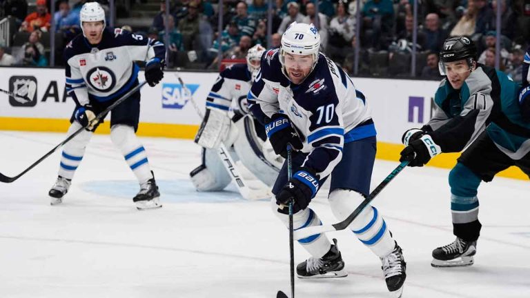 Winnipeg Jets left wing Tanner Pearson (70) moves the puck during the third period of an NHL hockey game against the San Jose Sharks. (Godofredo A. Vásquez/AP)