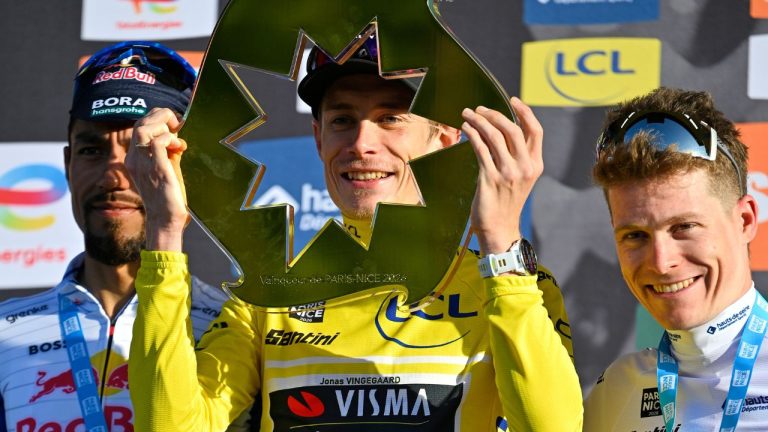 Jonas Vingegaard of Denmark, wearing the overall leader's yellow jersey, center, Daniel Martinez Poveda of Colombia,left and second place, and Georg Steinhauser of Germany, third place and wearing the best young rider's white jersey, celebrate on the podium after the last stage of the Paris Nice cycling race with start and finish in Nice, France, Sunday, March 15, 2026. (Philippe Magoni/AP)