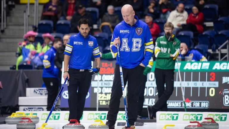 Team Alberta Vice-skip Aaron Sluchinski, left, and Skip Kevin Koe study the house during Draw 14 at the Montana's Brier Canadian men's curling championship, in St. John's, N.L., on Wednesday, March 4, 2026. (Paul Daly/CP)