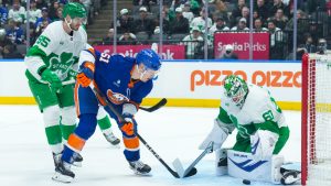 New York Islanders' Emil Heineman, centre, shoots on Toronto Maple Leafs goaltender Joseph Woll during first period NHL hockey action in Toronto, on Tuesday March 17, 2026. (Chris Young/CP)